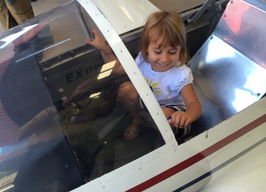 A future wolverine enjoys her time in a plane.